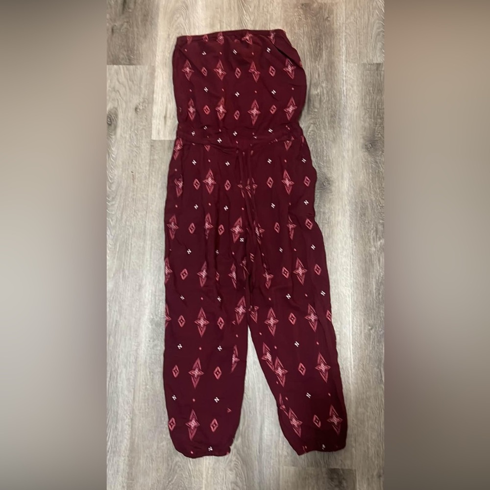 Burgundy jumpsuit Size small. New with tag